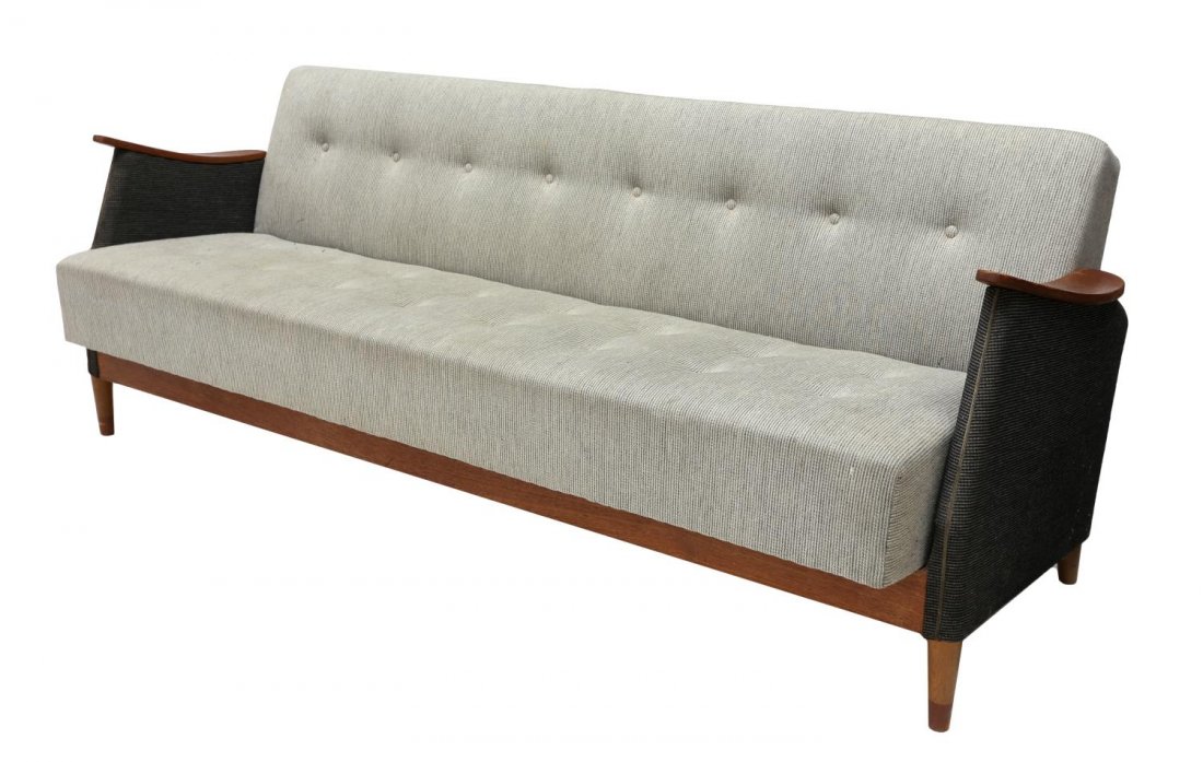 L. CHR LARSEN & SON DANISH MID-CENTURY MODERN SOFA: L. Chr. Larsen & Son mid-century modern sofa, Denmark, c. 1950's/60's, curved teakwood arms and upholstered sides enclose the slightly reclined long back and seat in buttoned upholstery, rising on tap