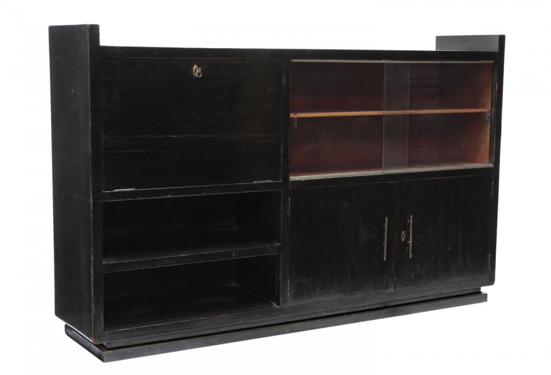 ITALIAN DESIGN ART DECO BOOKCASE, C. 1930: Italian design Art Deco bookcase, c. 1930, having a fall front door over two shelves, beside two sliding glass doors, over double doors, fitted with shelves, 44.5"h, 71"w, 15.5"d Start Price: $250.00