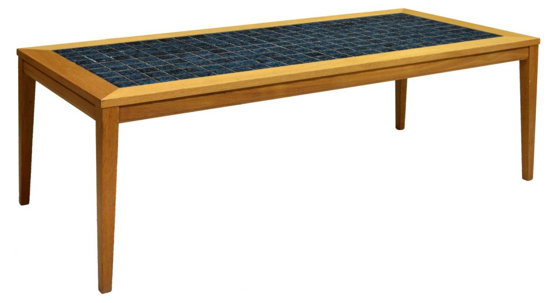 LONG DANISH MODERN TILE TOP COFFEE TABLE: Danish modern coffee table, c. 1960's/70's, the long top with inset tiles, raised on tapered legs, approx 19"h, 55.75"l, 24.25"w Start Price: $100.00