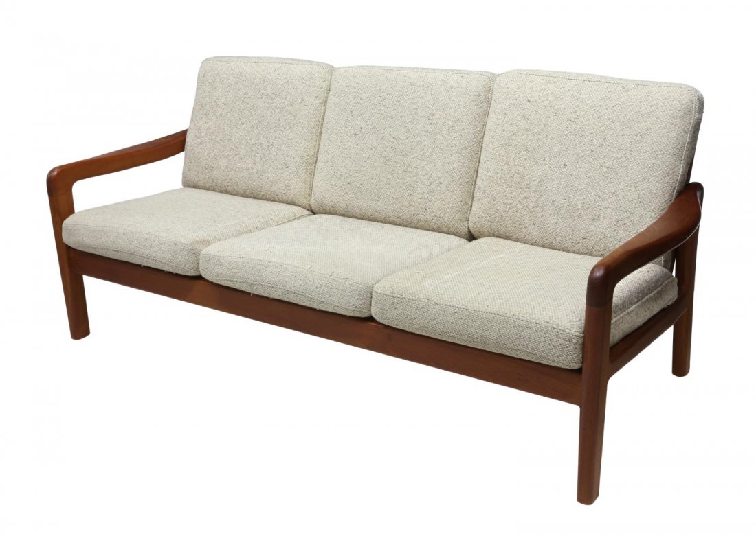 DANISH MID-CENTURY MODERN TEAKWOOD SOFA: Danish mid-century modern open arm sofa, c. 1950s/1960s, having a teakwood frame with removable cream cushions, 34"h, 73"w, 32"d Start Price: $150.00