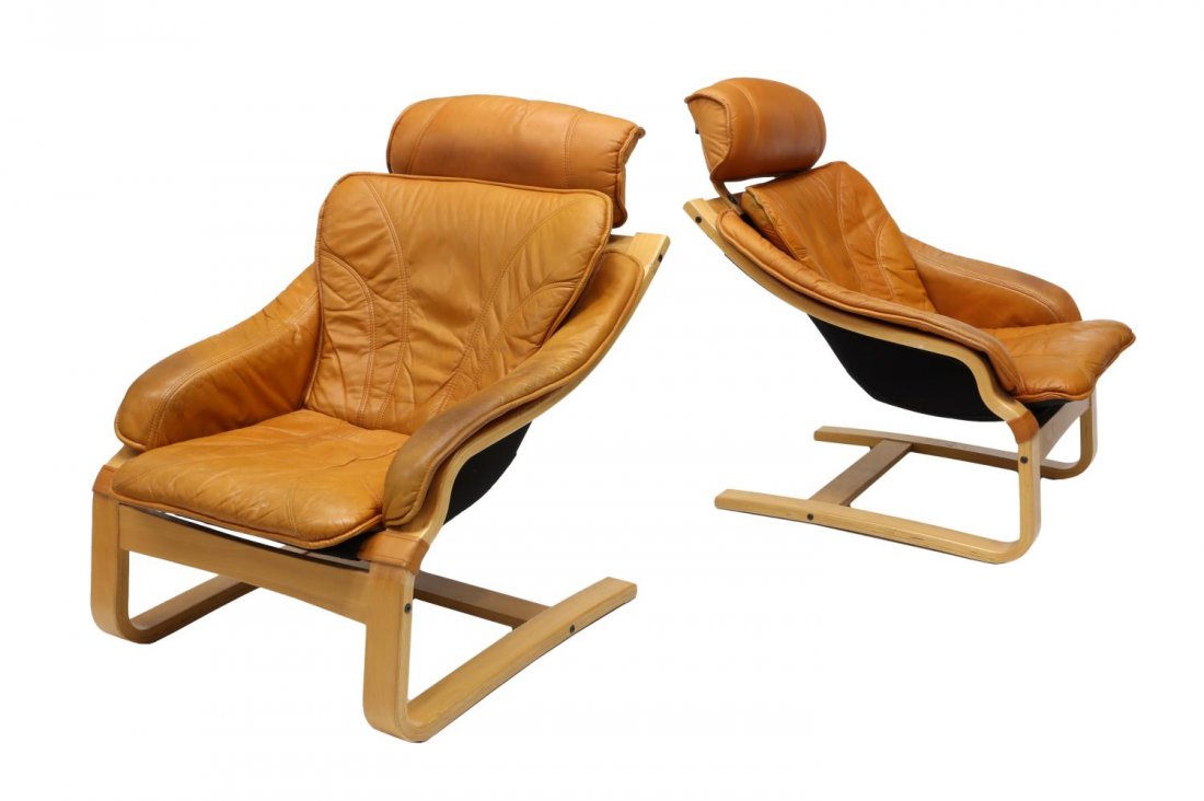 (2) DANISH MODERN LEATHER LOUNGE CHAIRS: (pair) Danish modern lounge chairs, c. 1960's/70's, each having leather cushioned seating on a bentwood frame, approx 39"h, 27.75"w, 29 Start Price: $300.00