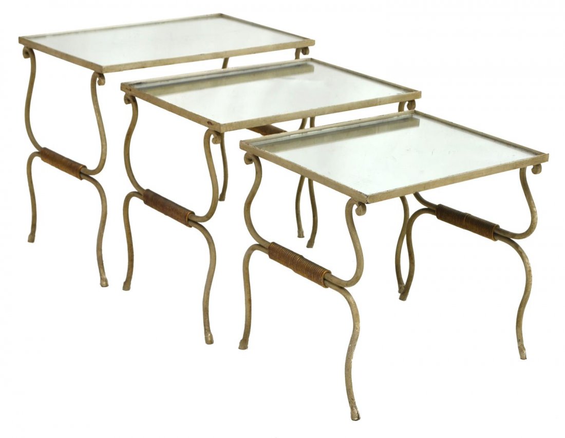 (3)SCROLLED IRON NEST OF TABLES WITH MIRRORED TOPS: (set of 3) Iron nesting tables, each inset with worn rectangular mirrored top, scrolled iron frame and supports, largest: 18.75"h, 19.5"w, 14.5"d, smallest: 17.5"h, 16.75"w, 13.5" Start Price: $80.00
