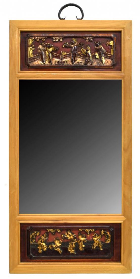 FRAMED ELMWOOD WALL MIRROR WITH ANTIQUE CARVINGS: Framed elmwood wall mirror, having two parcel gilt and lacquered antique carved panels of dancing figures flanking the plain mirror plate, approx 31.5"h, 15.25"w, 7lbs Start Price: $80.00