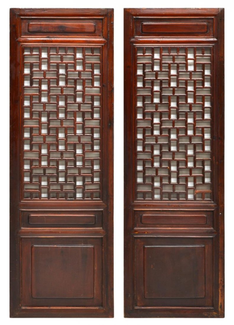 (2) CHINESE LACQUERED ELMWOOD WINDOW PANELS: (pair) Antique Chinese lacquered elmwood window panels, each with geometric pierced sections, one having painted characters to top, surface wear consistent with age, one with restoration to bottom of 