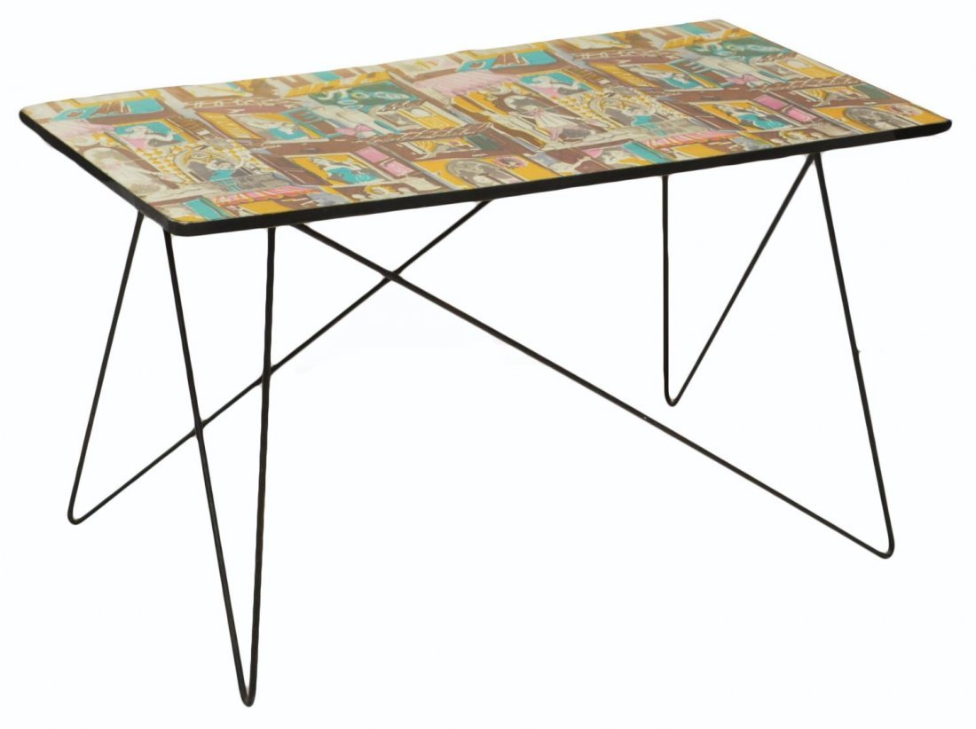 MID-CENTURY COFFEE TABLE MANNER OF FORNASETTI: Italian mid-century modern coffee table in the manner of Piero Fornasetti (Italian, 1913-1988), c. 1960's, the laminated wood top with polychrome town scene of beauties at the window, on a free form t