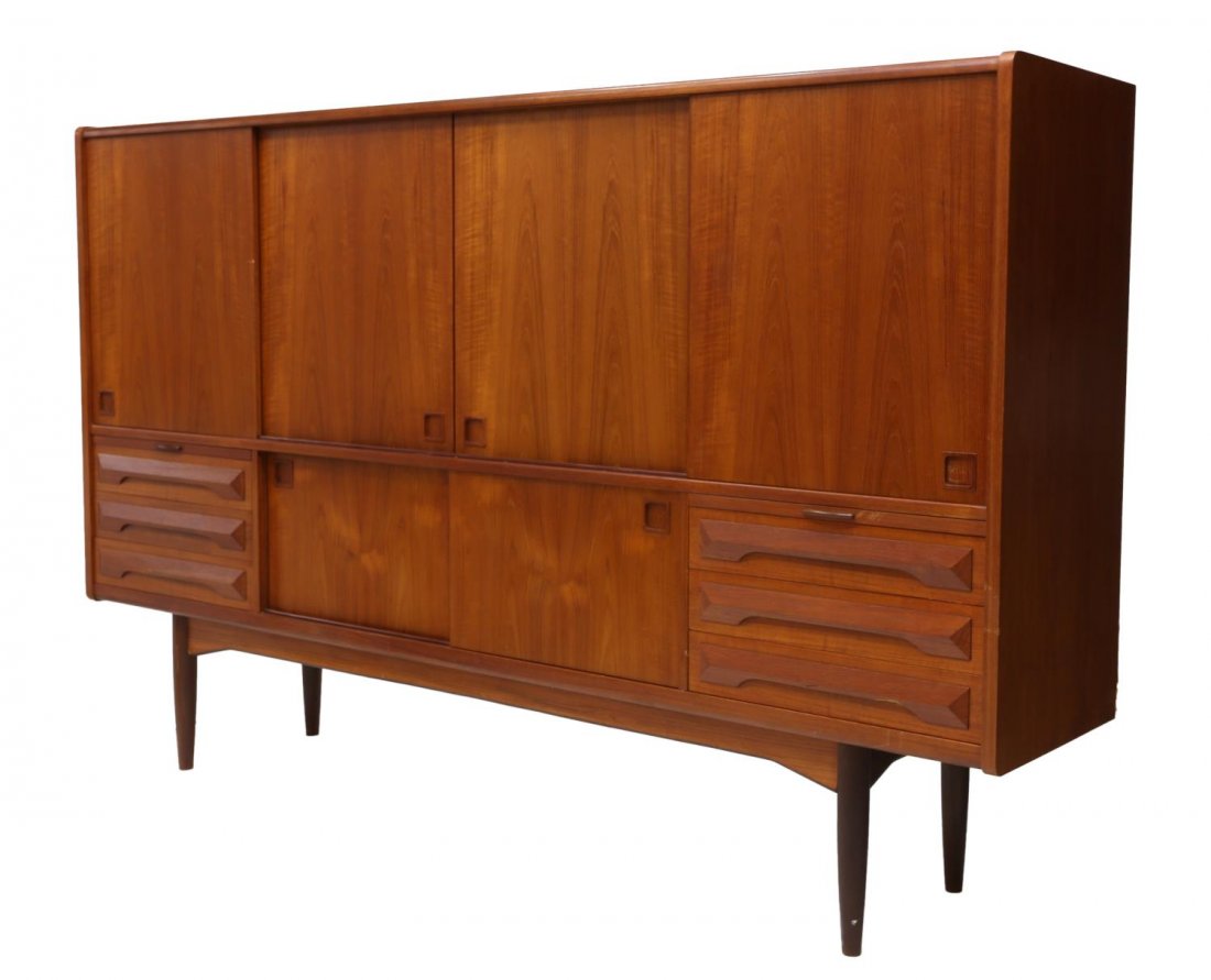 DANISH MID-CENTURY MODERN TEAKWOOD SIDEBOARD: Danish mid-century modern teakwood sideboard, the rectangular case with sliding doors fitted with shelves and drawers, one glass shelf intact with glue restoration, above second set of sliding doors, 