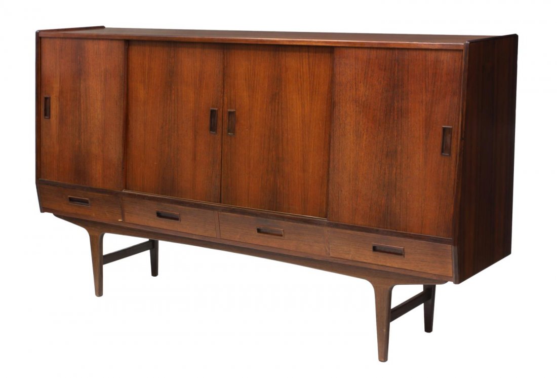 DANISH MID-CENTURY MODERN ROSEWOOD SIDEBOARD: Danish mid-century modern rosewood sideboard, c. 1950's/60's, the rectangular top over four sliding doors, opening to sections with shelves, mirrors and tray drawers, above three drawers, raised on st