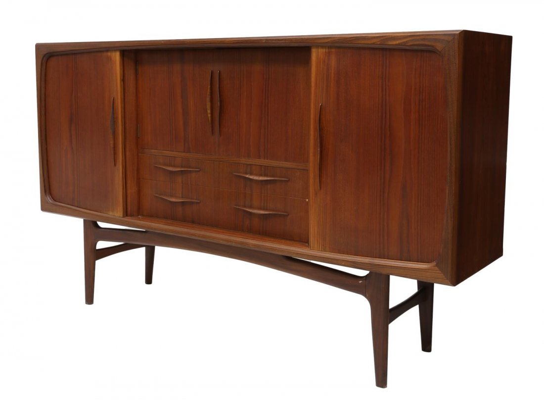 DANISH MID-CENTURY MODERN TEAK HIGH SIDEBOARD: Danish mid-century modern electrified high sideboard, c. 1950s/1960s, having two center doors opening to mirrored bar, over two drawers, flanked by sliding doors concealing shelves and drawers, rising
