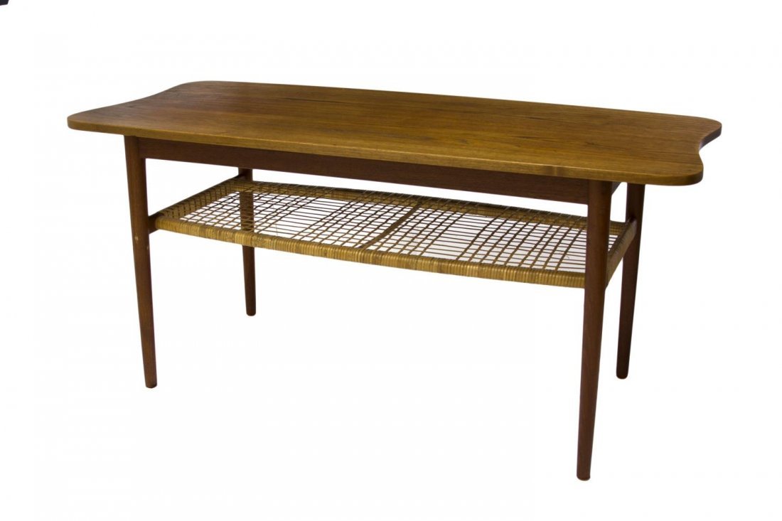 DANISH MID-CENTURY MODERN TEAKWOOD COFFEE TABLE: Danish mid-century modern teakwood coffee table, 1950's, a shaped top over a lower tier with open rush weaving, rising on tapered turned legs, 22"h, 47"w, 21.5"d Start Price: $150.00