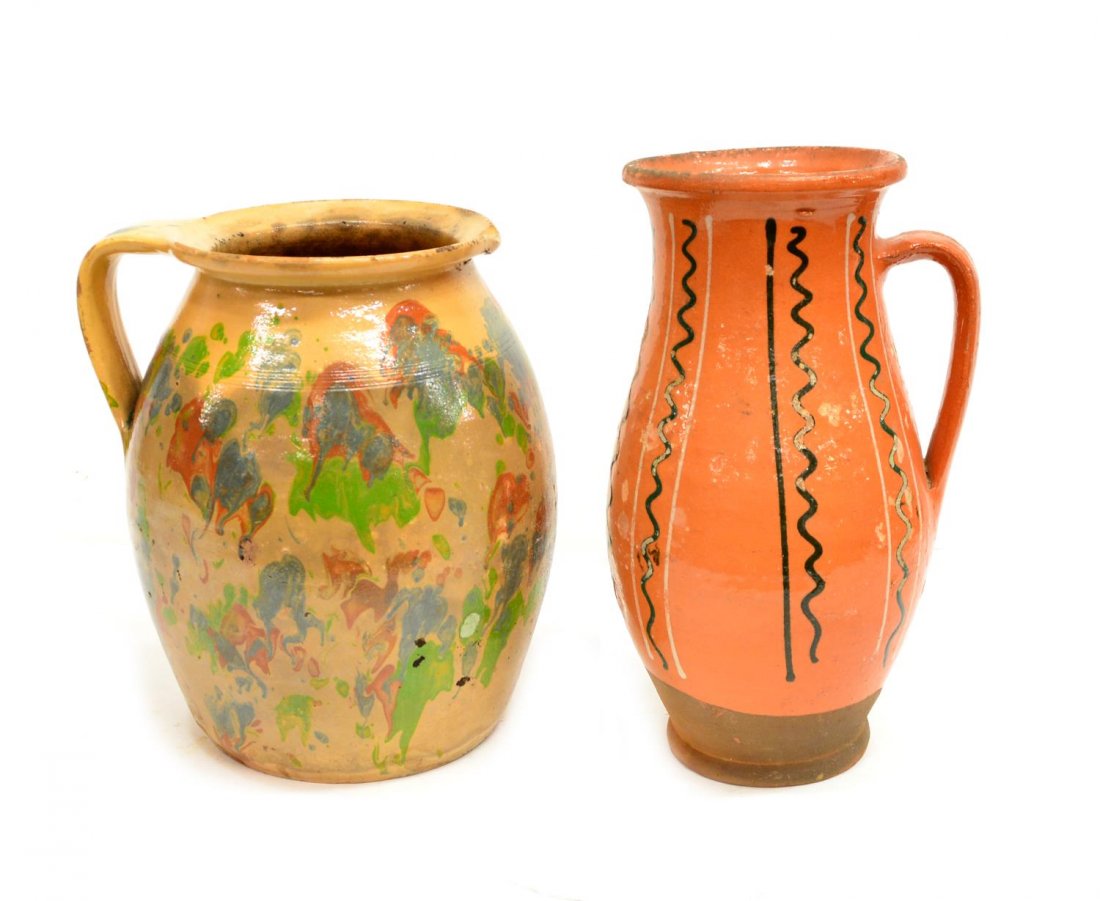 (2) ANTIQUE CONTINENTAL EARTHEWARE VESSELS: (lot of 2) Antique French / Continental earthenware vessels, including: (1) glazed pitcher having polychrome mottled drip glaze in green, rust and blue on a tan ground, 9.25"h; (1) handled pitcher in