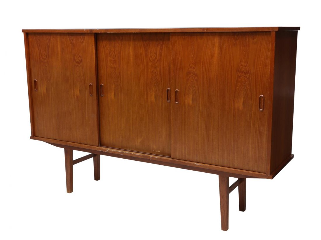 DANISH MID-CENTURY MODERN TEAKWOOD SIDEBOARD: Danish mid-century modern teakwood sideboard, having sliding doors fitted with shelves and drawers, rising on squared tapered legs, 45.75"h, 59"w, 17"d Start Price: $300.00