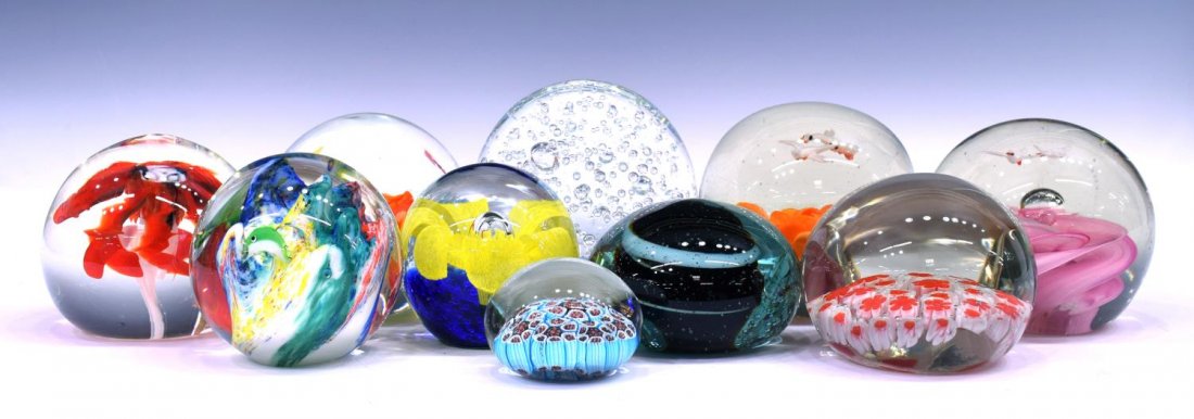 (10) COLLECTION OF ART GLASS PAPERWEIGHTS: (lot of 10) Collection of art glass paperweights, highlights include floral with bird and butterfly designs, millefiori, bubbles, and more, largest: 4.25"h, 14lbs Start Price: $50.00