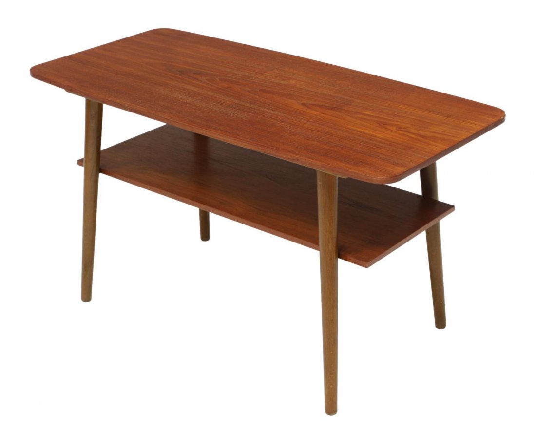 DANISH MID-CENTURY MODERN TEAKWOOD COFFEE TABLE: Danish mid-century modern teakwood coffee table, 1950's, the rectangular top rising on angled turned legs joined by a lower shelf, 21.5"h, 38.75"w, 18.75"d Start Price: $80.00