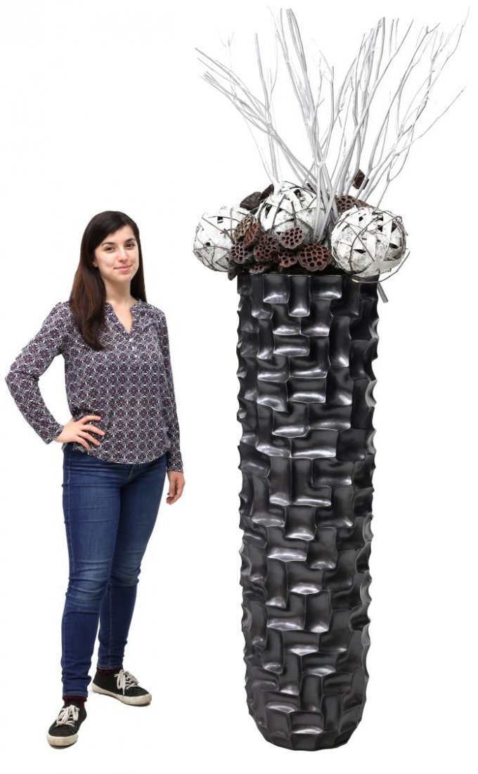 LARGE CAVA RECTANGLES PLANTER & FAUX PLANT: Large Cava "Rectangles" planter, executed in grey/black and surmounted by faux plant arrangement, planter only: approx 57"h, with arrangement: approx 97"h; some minor chipping to edges Start Price: $1