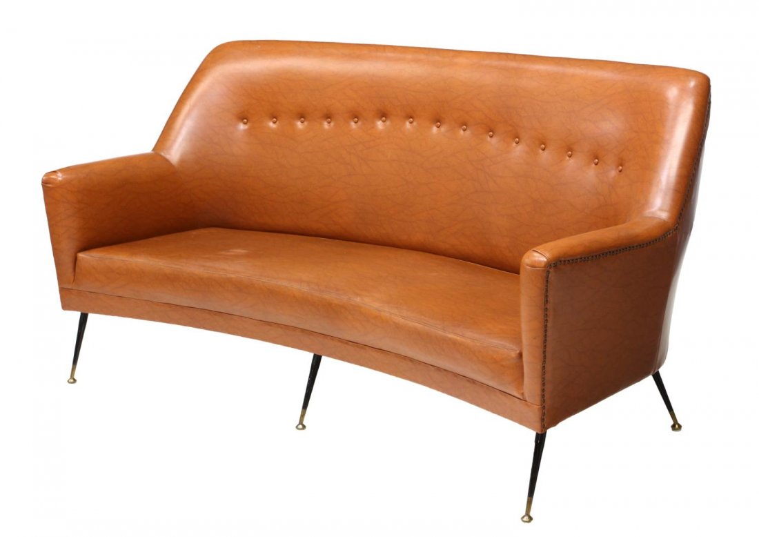 ITALIAN MID-CENTURY UPHOLSTERED SOFA C. 1950s: Italian mid-century upholstered sofa, c. 1950s, in brown faux leather, accented with single button back and nail head trim, over a shaped seat, rising on black and brass tapered legs, 38"h, 72"w, 31"d