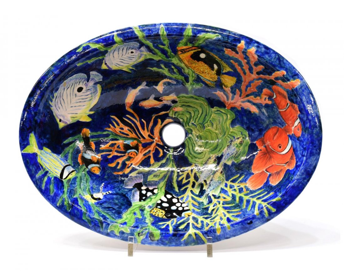 HAND PAINTED PORCELAIN AQUATIC SINK, CHILE 20TH C.: Hand painted porcelain aquatic sink, Chile 20th c., depicting a variety of ocean life on a blue ground, 6"h, 19"w, 14"d, 8.5lbs Start Price: $80.00