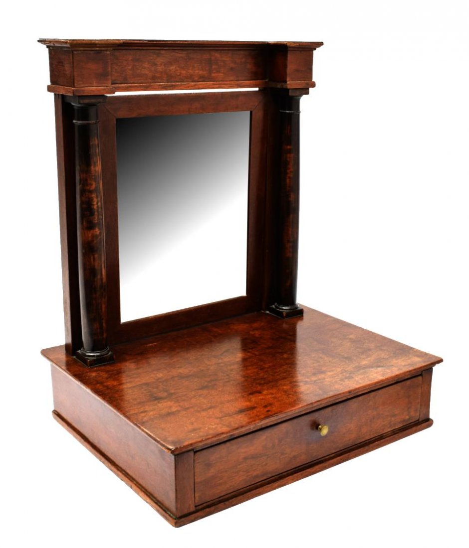 FRENCH EMPIRE MAHOGANY SWING MIRROR, 19TH C.: French Empire style mahogany swing mirror, 19th c., the corniced top above a rectangular mirror plate, flanked by Doric column form supports, mounted to a rectangular case with single drawer, fitted i