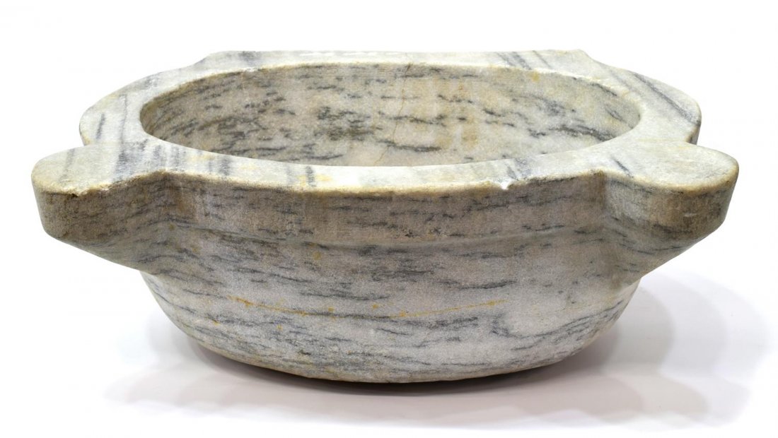 TURKISH VARIEGATED MARBLE SINK: Variegated marble sink, Turkey, having a shaped top around an oval bowl, 7'h, 17"w, 14.5"d Start Price: $80.00