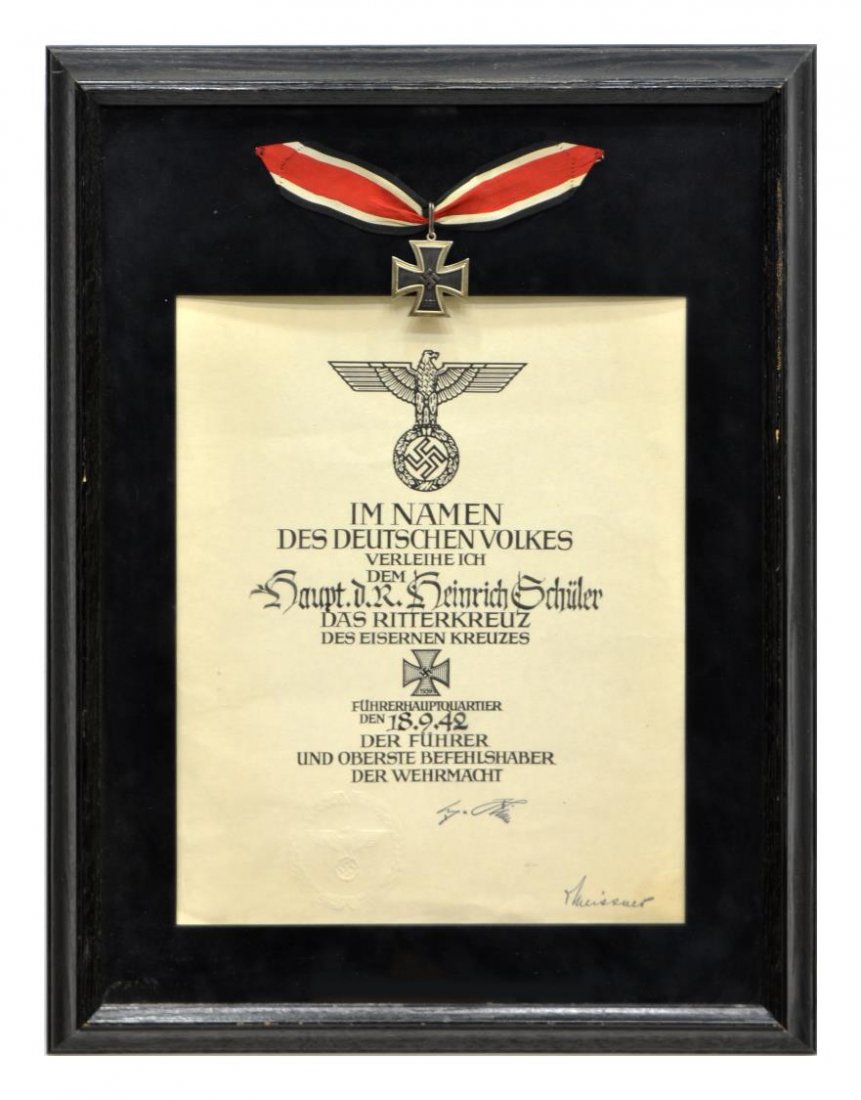 GERMAN KNIGHT'S CROSS, CERTIFICATE, HITLER SIGNED: Shadow box framed certificate and Knights Cross of the Iron Cross medal presented September 18, 1942 to then Captain Heinrich Georg Schuler (1903-1945), bearing the signature of Adolf Hitler, Schuler,