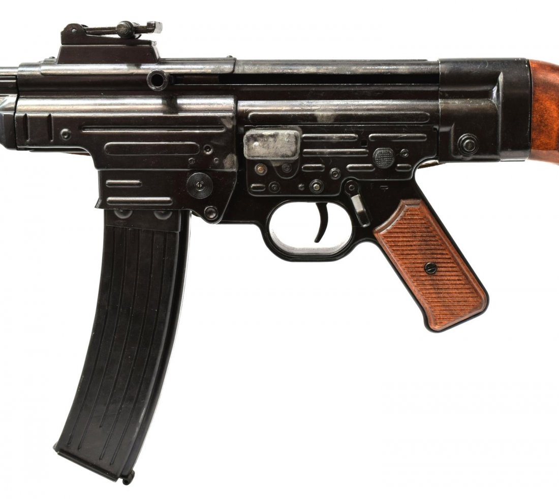 GERMAN MODEL 44 NON-FIRING PROP MACHINE PISTOL: German WWII Machine Pistol, Model 44, a non-firing prop made of black metal with wood grips and stock, 36.75"l, *Provenance: Dispersal of the Blanco County WW2 Museum collection, Blanco, Texas.* Start