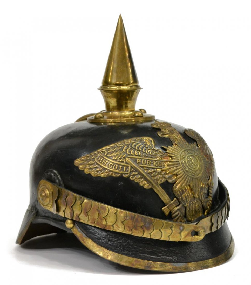 GERMAN PICKELHAUBE SPIKE HELMET, PRUSSIAN: German Pickelhaube spike helmet, the black leather helmet with brass spike, Prussian brass eagle, brass chin scale, later leather interior liner, 9.5"h, 9.5"w, 7.5"d, 1.25lbs *Provenance: Dispersal of