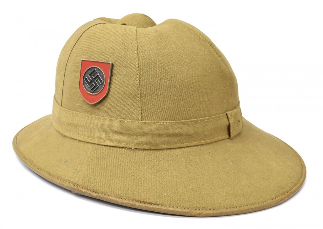 GERMAN WWII AFRICA CORPS SS PITH HAT: German WWII Africa Corps pith hat, light brown, swastika red badge on one side, SS badge on opposite side, size 57, 6"h, 13.75"w, 10.75"d, .75lb *Provenance: Dispersal of the Blanco County WW2 Museum 