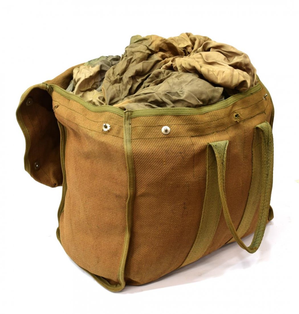 GERMAN WWII LUFTWAFFE PARACHUTE & STORAGE BAG: German WWII Luftwaffe parachute and storage bag used by the Fallschirmjager (Paratrooper Infantry), top of bag marked "FL 30220", bag fasteners marked "Zieh Hier", two part parachute with cord, all fa