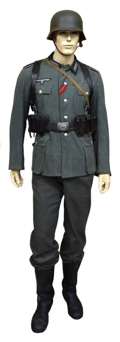 GERMAN WWII SOLDIER DRESSED MUSEUM MANNEQUIN: German WWII dressed mannequin representing an infantry soldier, original tunic with Eastern Front ribbon, original belt and buckle, gas mask canister, cook pot, A frame at back, original helmet with l