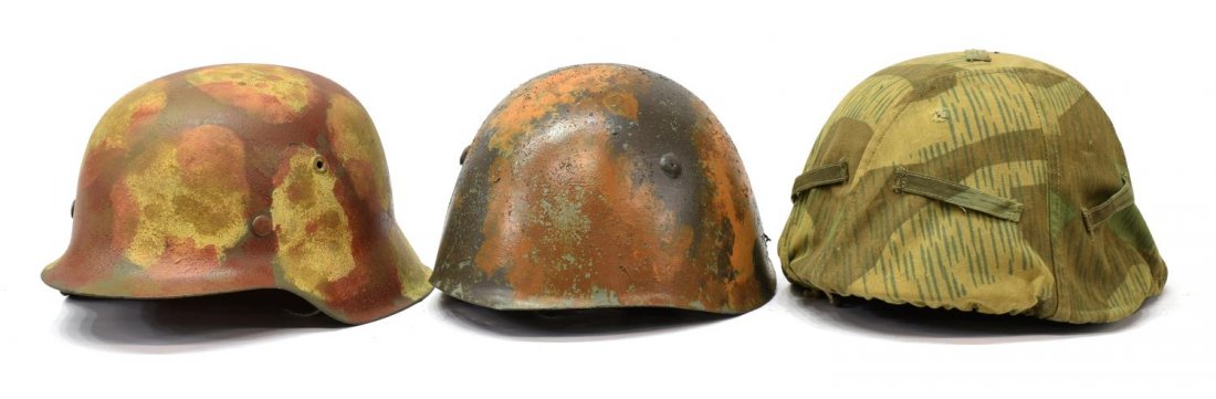 (3) ITALIAN WWII MILITARY HELMET, 2 GERMAN HELMETS: (lot of 3) Military helmets: (1) Italian WWII helmet; (1) German helmet, camouflage; (1) German helmet with cloth camouflage cover, lacking interior head band, largest: 6.5"h, 111.75"w, 9.5"w, total: 