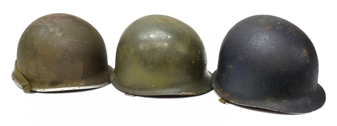(3) WWII U.S. ARMY & NAVY MILITARY HELMETS: (lot of 3) U.S. Army & Navy WWII military helmets: (1) Navy helmet shell and liner, both with blue finish, rim seamed at front, swivel chinstrap bails; (1) Army helmet shell and liner, rim seamed at f