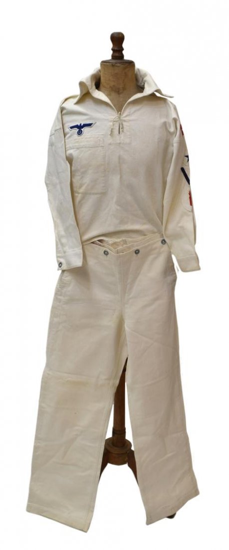 GERMAN WWII KRIEGSMARINE NAVAL UNIFORM, PATCHES: WWII German Kriegsmarine Navy enlisted man's white two part uniform, the blouse right breast with the Nazi eagle patch, the left arm with two sewn red stripes at shoulder above a blue star patch, blue