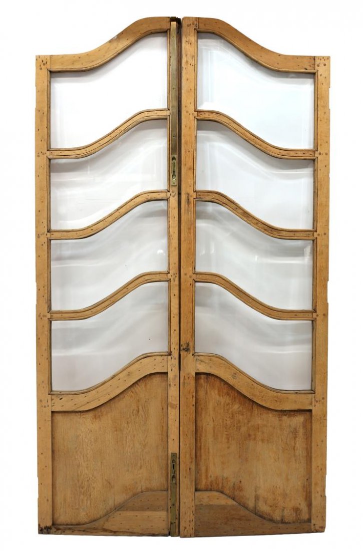 (PAIR) WOOD & BEVELED GLASS DOORS: (pair) Wood doors, each with four beveled glass panels over a lower wood panel, some brass hardware present, approx. 97'h, 28"w Start Price: $200.00