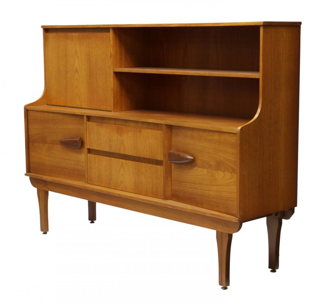DANISH MID-CENTURY MODERN TEAKWOOD SIDEBOARD: Danish mid-century modern side board, 1960's, rectangular, the upper part with shelves at one side, a drop front laminate writing surface at the other, the lower part with two central drawers and flan