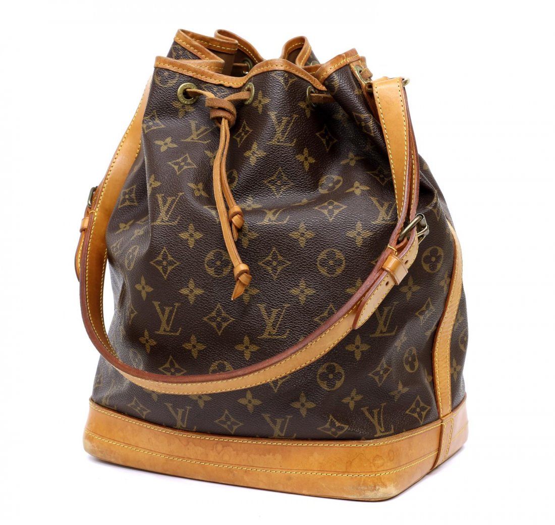 LOUIS VUITTON 'NOE GM' MONOGRAM CANVAS SHOULDERBAG: Louis Vuitton "Noe GM" drawstring shoulder bag in monogram canvas, having leather shoulder strap, piping, and trim, the drawstring top opening to brown canvas lined interior, patination, spotting and 