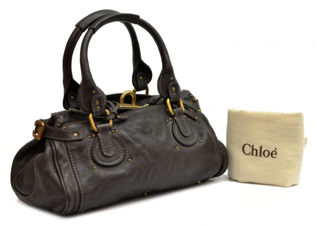 CHLOE DARK CHOCOLATE BROWN PADDINGTON PURSE: Chloe "Paddington" handbag in dark chocolate brown grained leather, having brushed gold and silver tone hardware, two exterior slot pockets, top unzips to dark brown cloth lined interior featuring slo