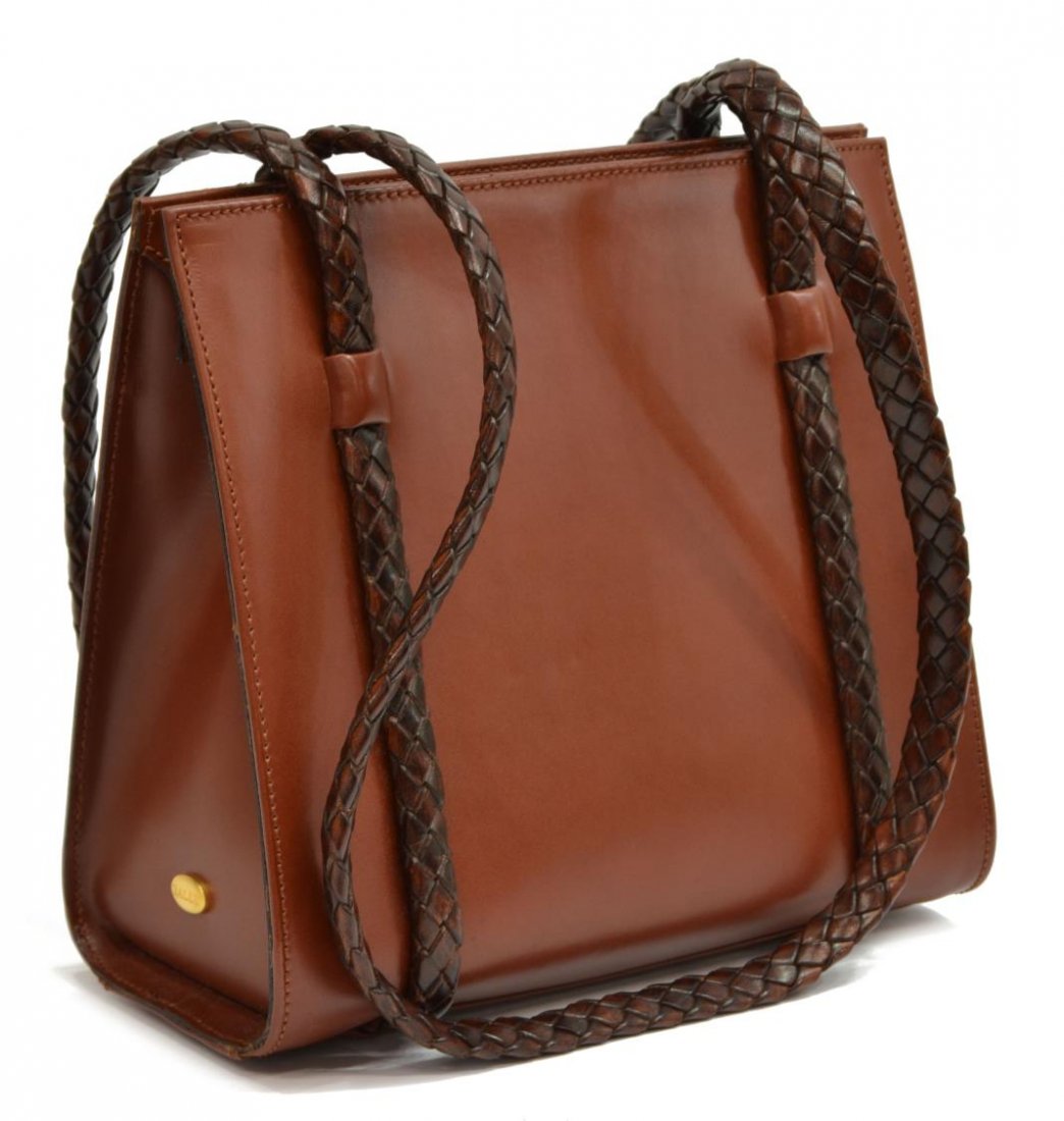 BALLY BRAIDED LEATHER STRAP SHOULDER BAG: Bally shoulder bag in smooth brown leather, having two braided leather shoulder straps, the snap top opening to brown leather lined interior with zipper compartment between open compartments, with one