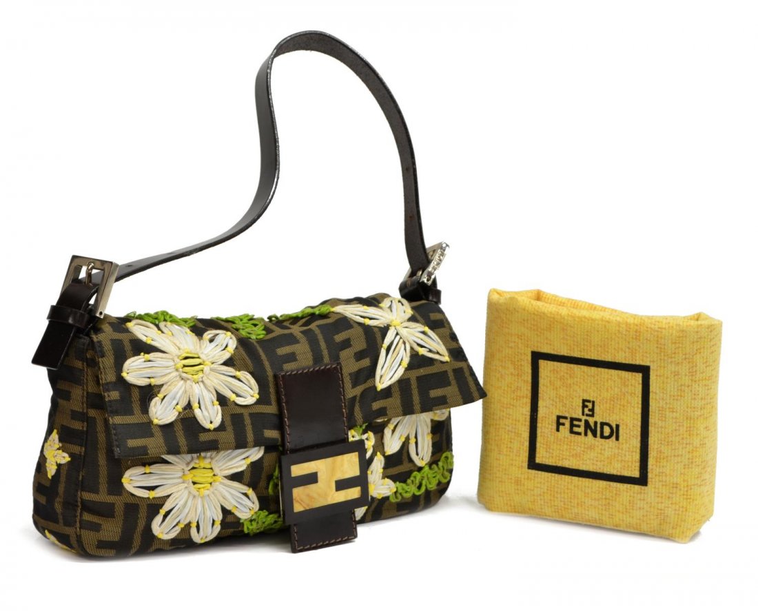 FENDI 'BAGUETTE' FLORAL EMBROIDERED MONOGRAM BAG: Fendi "Baguette" handbag in monogram silk, having leather handle and trim, silver tone hardware, overall decoration of raffia and thread floral embroidery, the flap top with hardstone logo clasp openi