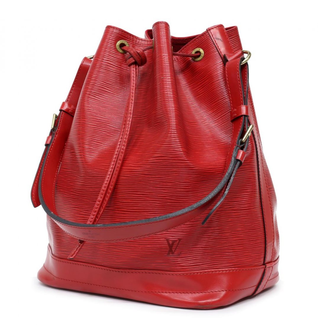 LOUIS VUITTON 'NOE GM' EPI LEATHER BUCKET BAG: Louis Vuitton "Noe GM" drawstring bucket bag in red Epi leather, having an adjustable shoulder strap, gold tone hardware, drawstring top opens to red fabric lined interior with key tab, wear to leathe