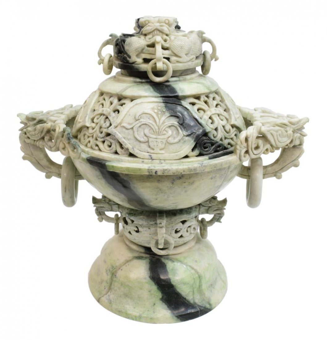 CHINESE CARVED HARDSTONE SEGEMENTED INCENSE BURNER: Chinese carved Burmese hardstone multi-segmented incense burner, having a pierced dragon form lid with rings, above the bowl form top decorated with foliate medallions, having impressive dragon form h