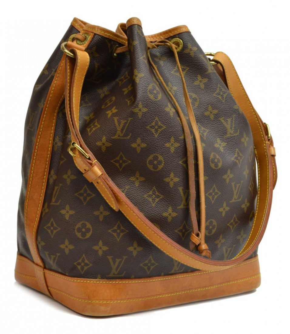 LOUIS VUITTON 'NOE GM' MONOGRAM CANVAS BUCKET BAG: Louis Vuitton "Noe GM" drawstring shoulder bag in monogram canvas, leather trim, gold tone hardware, the drawstring top opening to brown canvas lined interior, patination, spotting, and wear to bottom