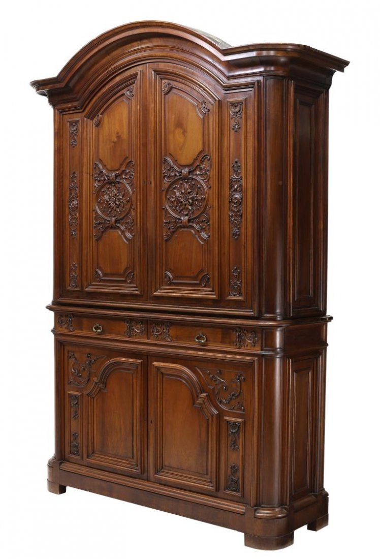 ITALIAN FINELY CARVED DUEX-CORP CABINET: Italian, finely carved, French style, walnut, duex corps cabinet, early 20th c., bearing the tags of Grazioli & Gaudenzi, Milan, the arched stepped cornice over two upper doors with carved foliate dec