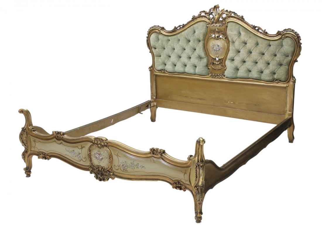 ITALIAN LOUIS XV STYLE UPHOLSTERED & GILDED BED: Italian Louis XV style painted frame and upholstered bed, the gilt and pierced frame around tufted panels, centered with floral cartouche, floral accented footboard, rising on short scroll form legs, 