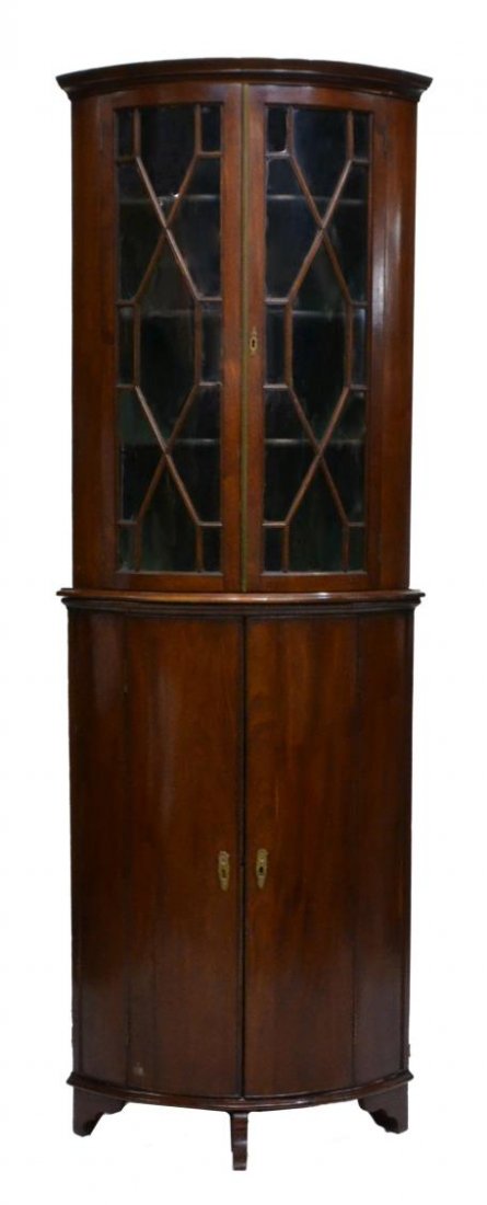 GEORGIAN MAHOGANY TWO-PART CORNER CABINET: Georgian mahogany corner cabinet in two-sections, glazed mullioned doors on the upper case, over solid doors on base, both concealing interior shelves, raised on bracket type feet, approx 80.25"h, 32.