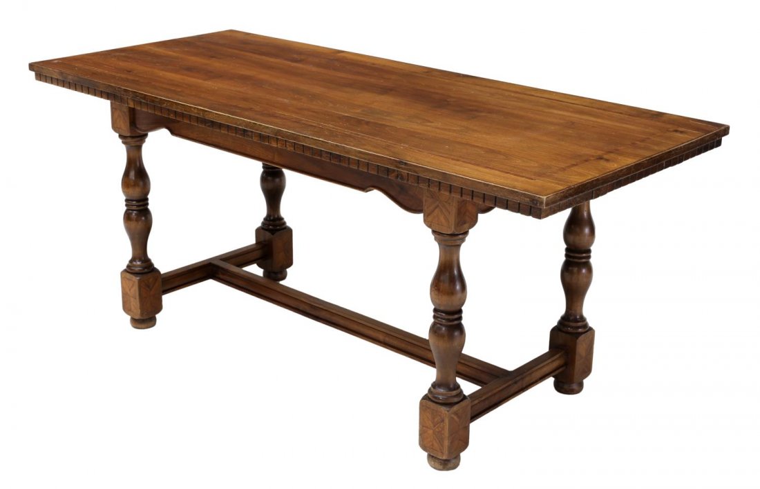 ITALIAN INLAID & BANDED WALNUT DINING TABLE: Italian walnut dining table, 20th c., the rectangular top having banded inlay, above a carved skirt, turned legs end in matched blocks, joined by stright stretchers, on bun feet, one end with pull out