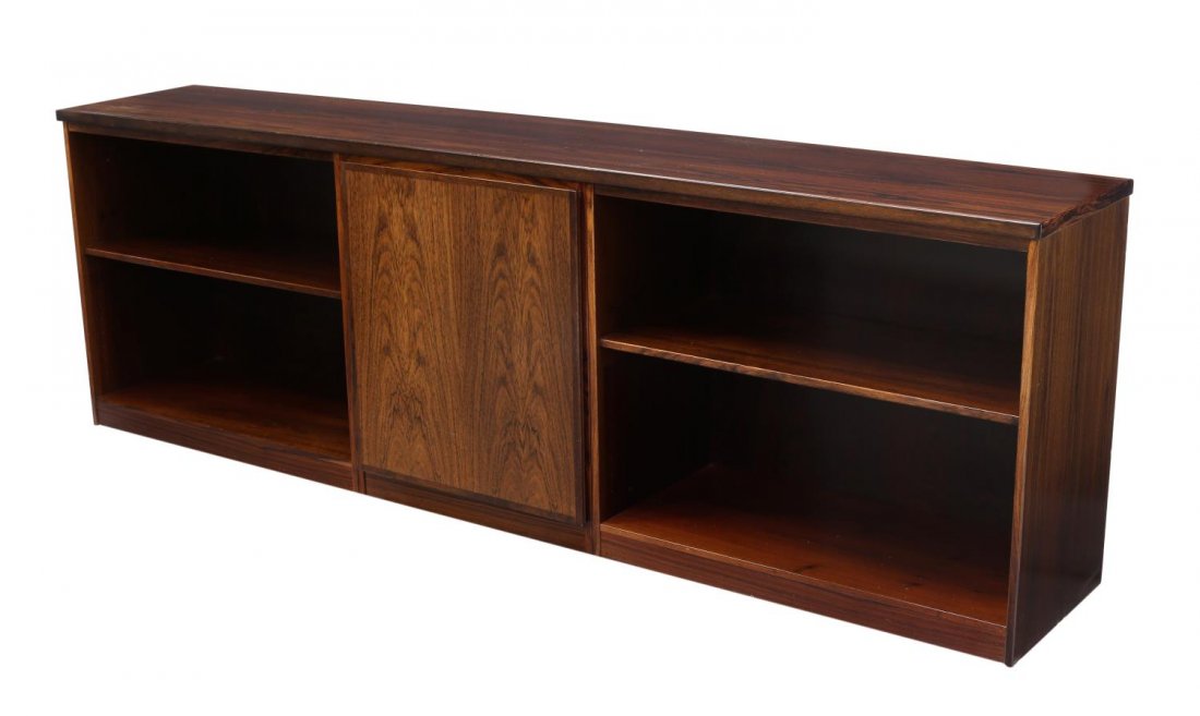 DANISH MID-CENTURY MODERN ROSEWOOD CREDENZA: Danish mid-century modern rosewood credenza, c. 1960's, the long rectangular case having open storage to either side, central door set with a single shelf, approx. 29.25"h, 89.25"w, 16"d Start Price: 