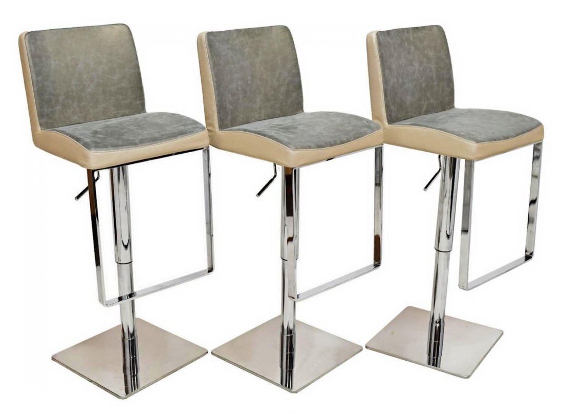 (3) CATTELAN, ALESSIO BASSAN MODERN BAR STOOLS: (lot of 3) Modern bar stools, Cattelan Italia, design by Alessio Bassan (b. 1962), two tone leather seat and back raised on the swivel adjustable height chrome steel pedestal with drop foot rest, all