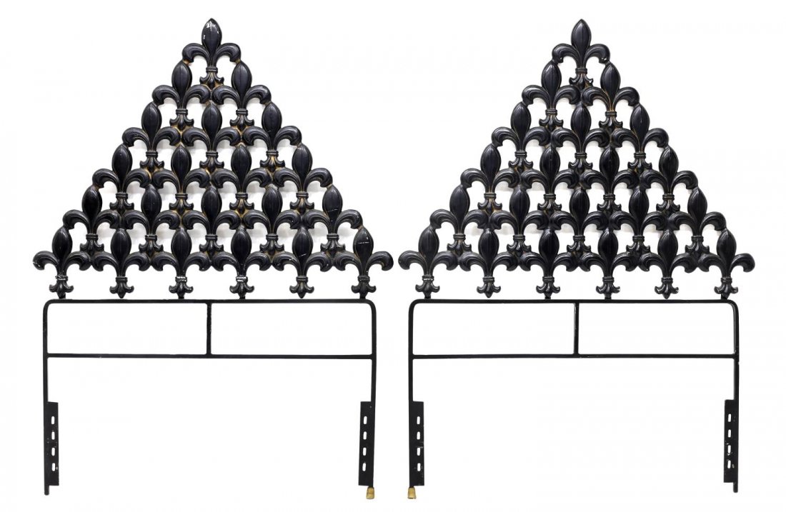 (2) TOMMI PARZINGER STYLE FLEUR-DE-LIS HEADBOARDS: (pair) Tommi Parzinger style cast iron twin size headboards, the triangular shape comprised of pierced fleur-de-lis, 56.25"h, 42.5"w Start Price: $200.00