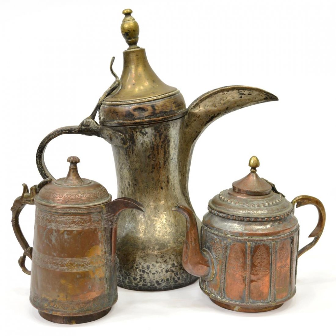 (3) GROUP ISLAMIC 'DALLAH' COPPERED COFFEE POTS: (lot of 3) Islamic "Dallah" metal coffee pots, comprising: (1) tall pot, having a turned finial surmounting the brass hinged lid, large spout over the silvered metal tapered body, 18.5"h; (1) short po