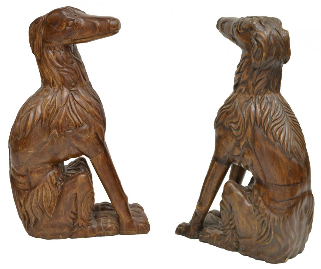 LIFE-SIZE BLACK FOREST STYLE CARVED DOG FIGURES: Large Black Forest style carved figures, each in the form of a seated dog, some wear, restoration, 33"h, 8"w, 19"d Start Price: $200.00