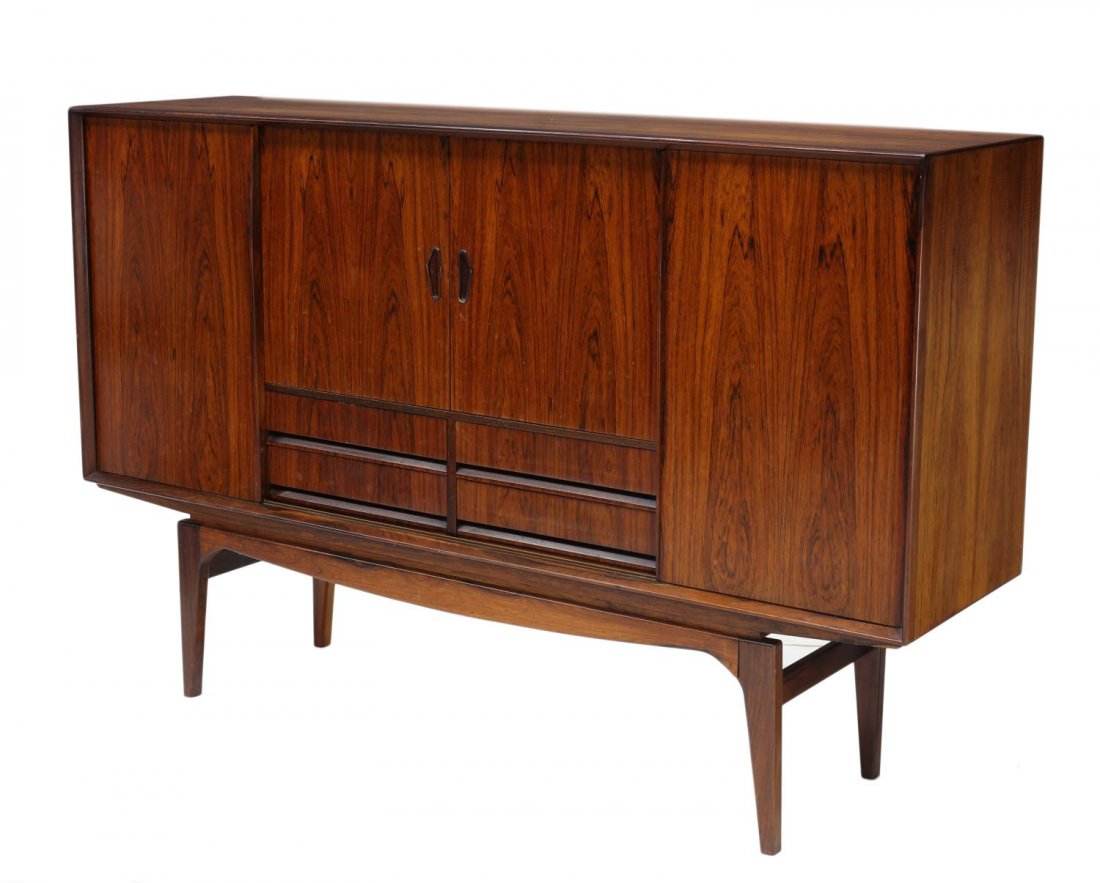 DANISH MID-CENTURY MODERN TEAKWOOD SIDEBOARD: Danish mid-century modern rosewood sideboard, 1960's, having sliding doors opening to shelves, drawers and lower drawers, rising on tapered supports, 45.75"h, 71"w, 18.5"d Start Price: $500.00